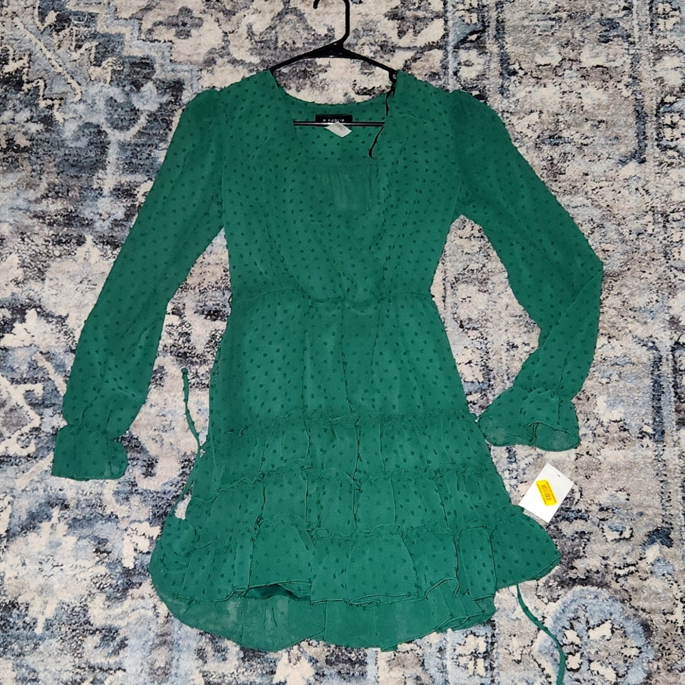 Green long sleeved dress.